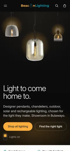 Beacon Lighting home page on a phone with three lit pendants
